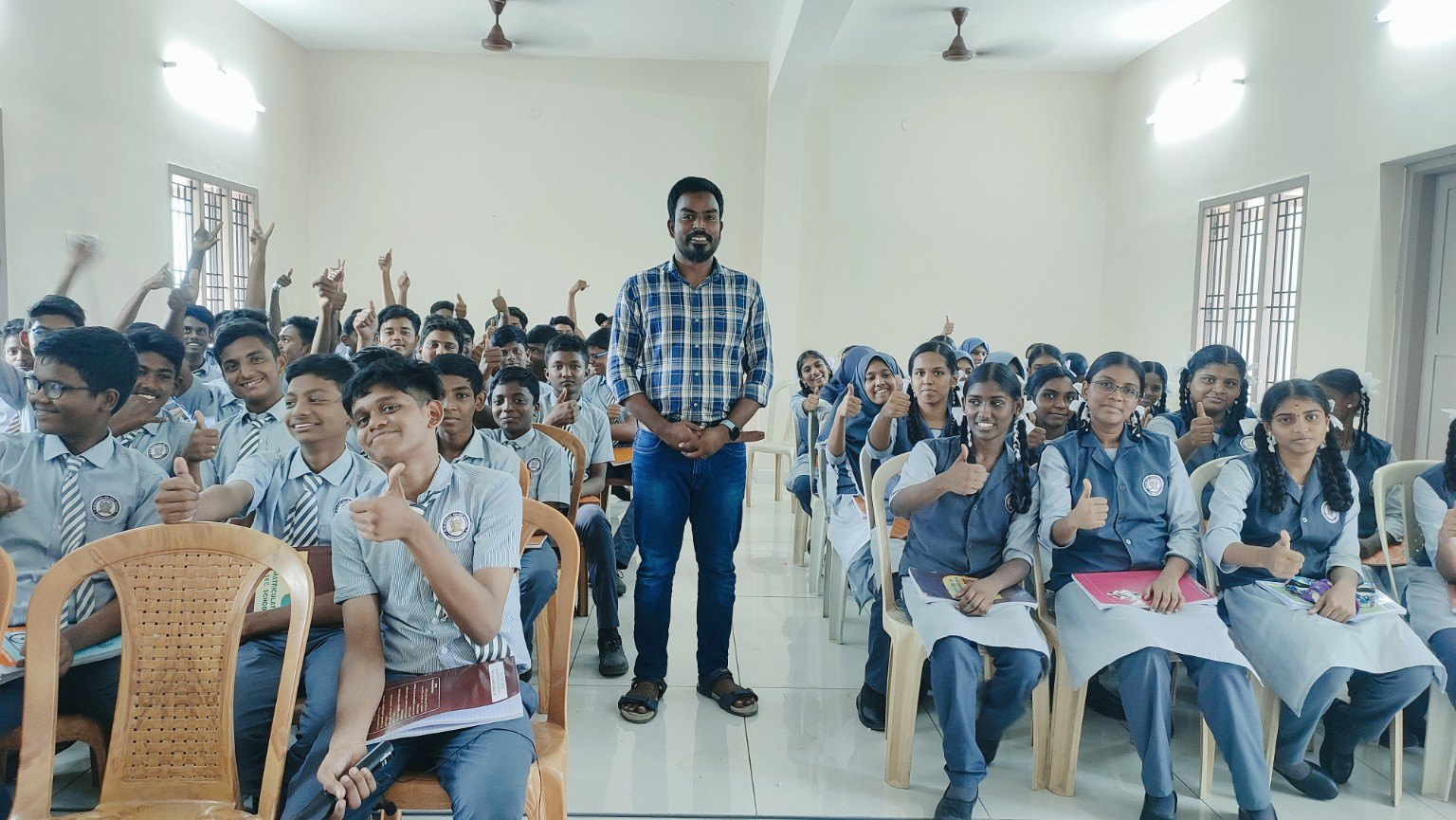 Founder with students after an interactive school session